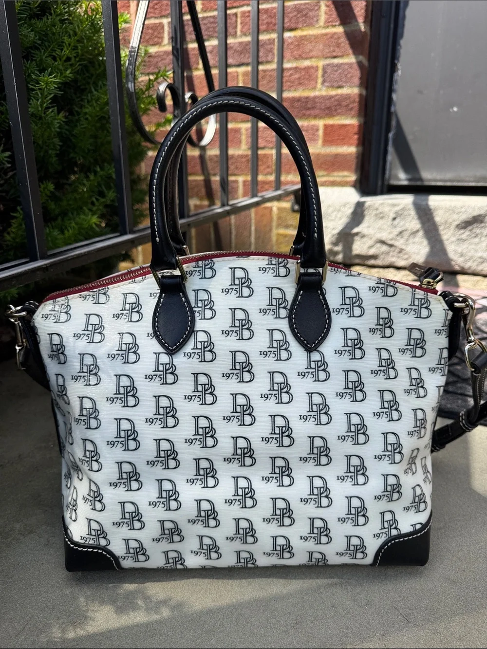 DOONEY AND BOURKE BLACK AND WHITE 1975 LOGO SATCHEL BAG
